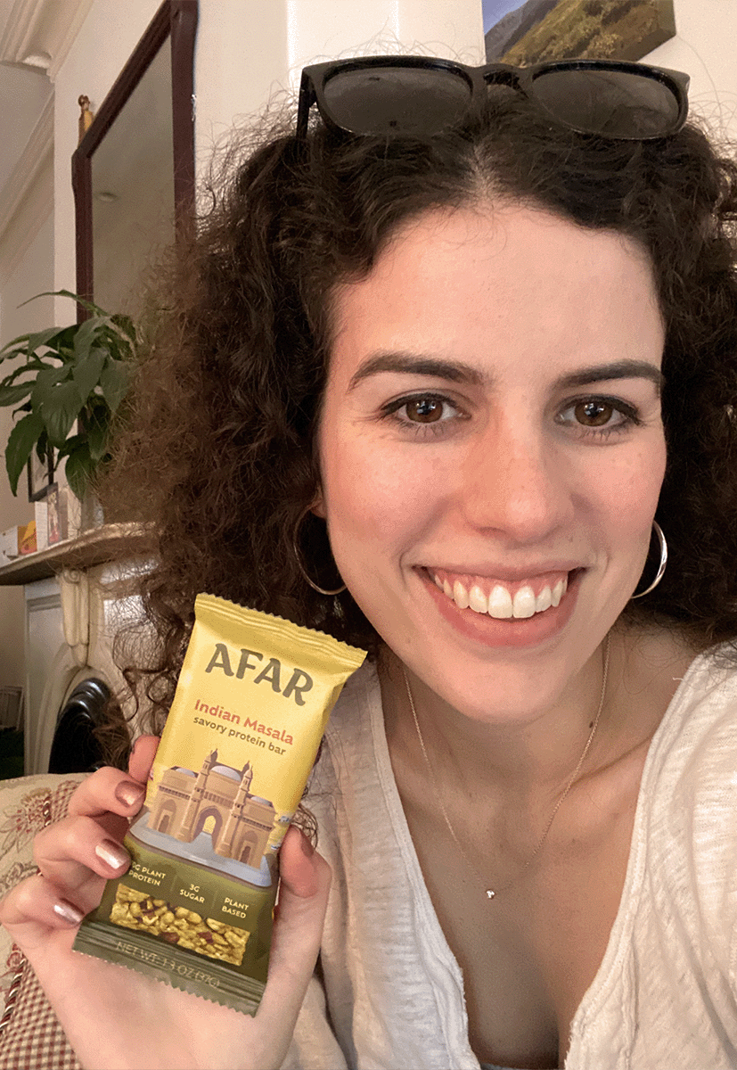 Woman holding Afar Indian Masala bar